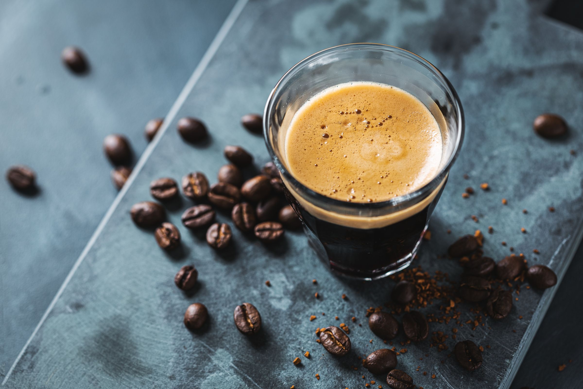 Close up classic fresh espress served on dark surface